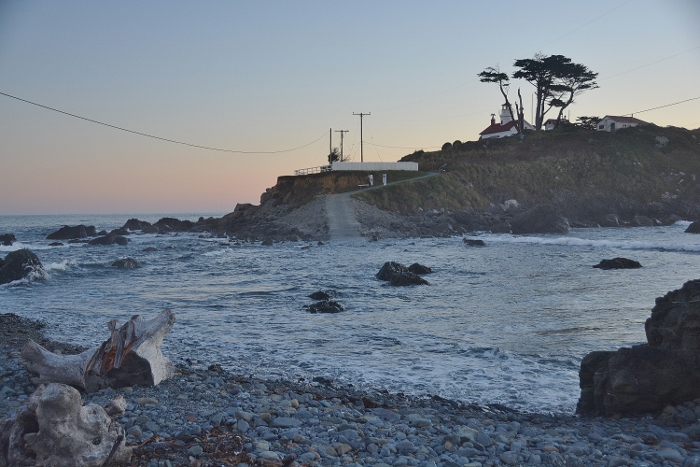 walking path to lighthouse is covered at high tide